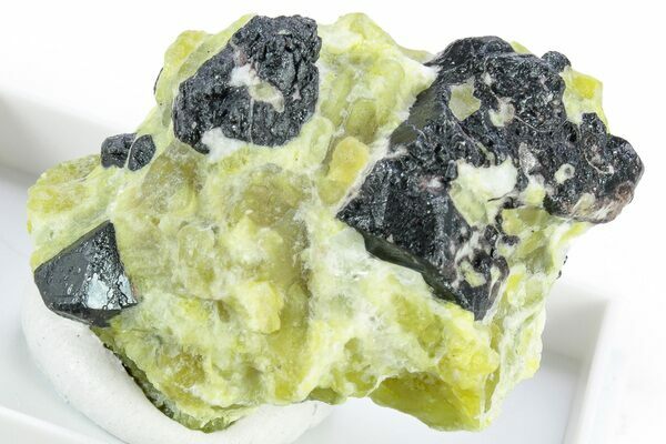 A specimen of Lizardite, a form of Serpentine with Hematite.